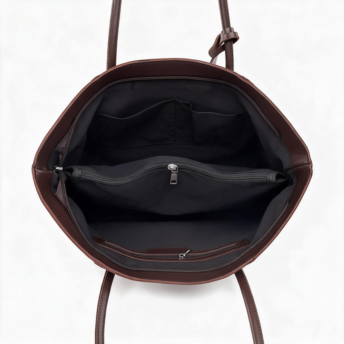 Open chocolate brown tote showing dark lining and interior zip pocket