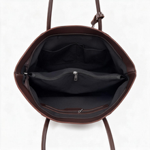 Open chocolate brown tote showing dark lining and interior zip pocket