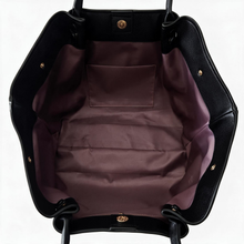 Open top and interior of the black winged tote bag
