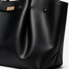 Close-up of black PU faux leather tote bag details