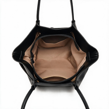 Zip-top opening and interior of black tote bag