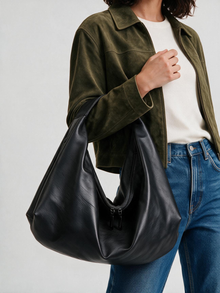 Woman carrying the black slouchy tote bag