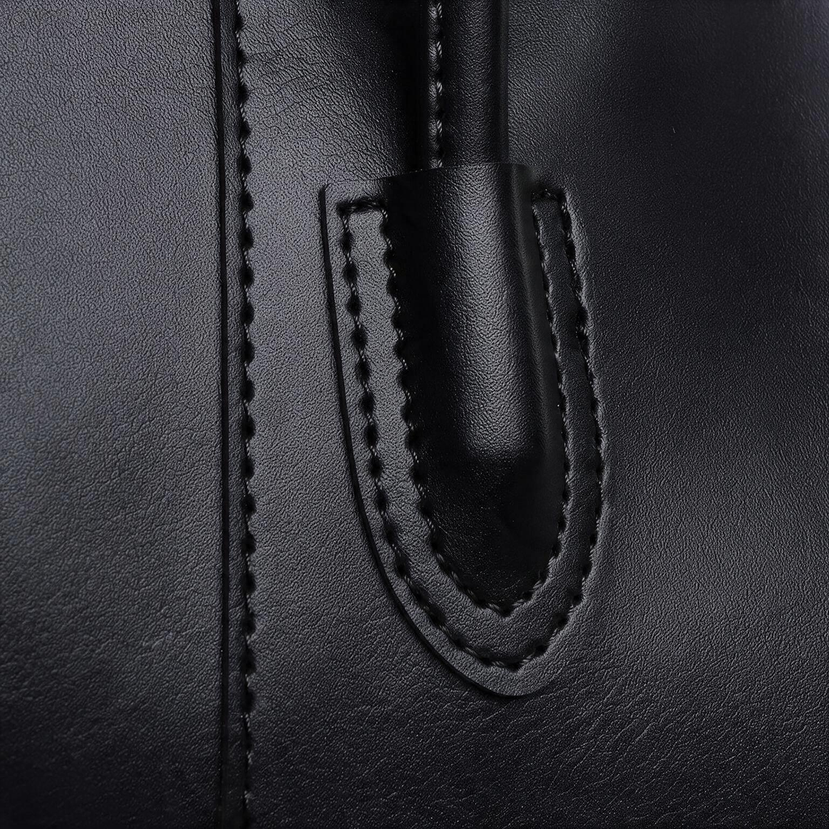Black tote bag close-up of handle stitching