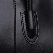 Black tote bag close-up of handle stitching