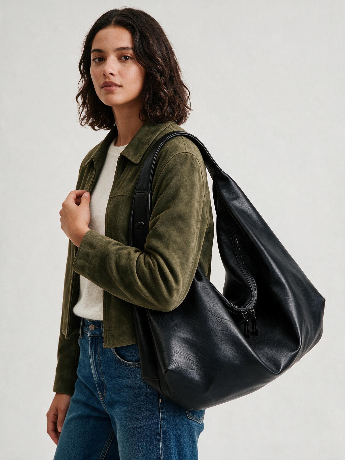 Woman wearing the black shoulder tote