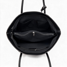 Open black shoulder tote showing interior pocket